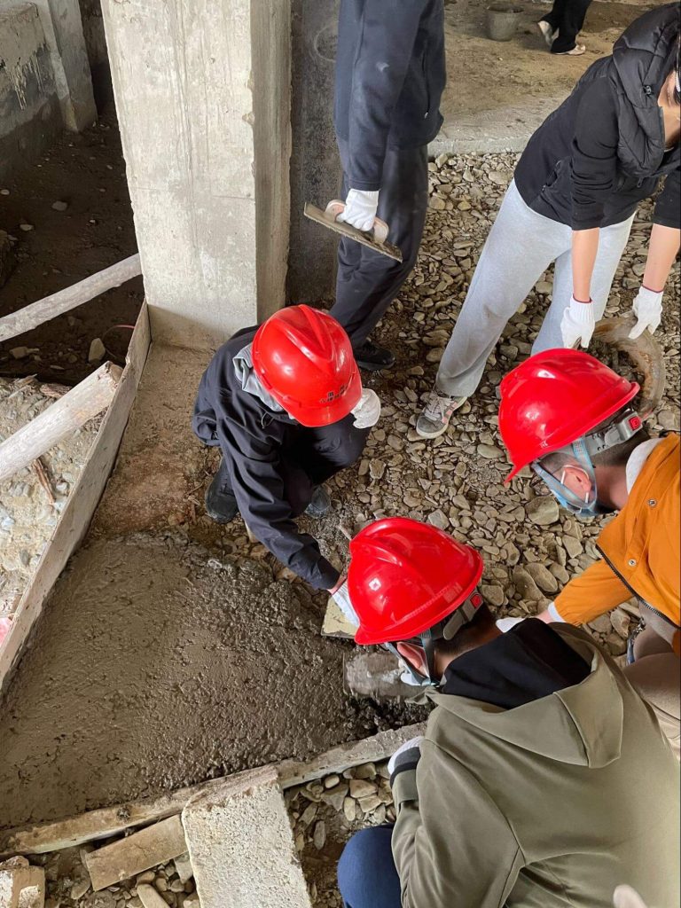 Children learning about the art of building construction